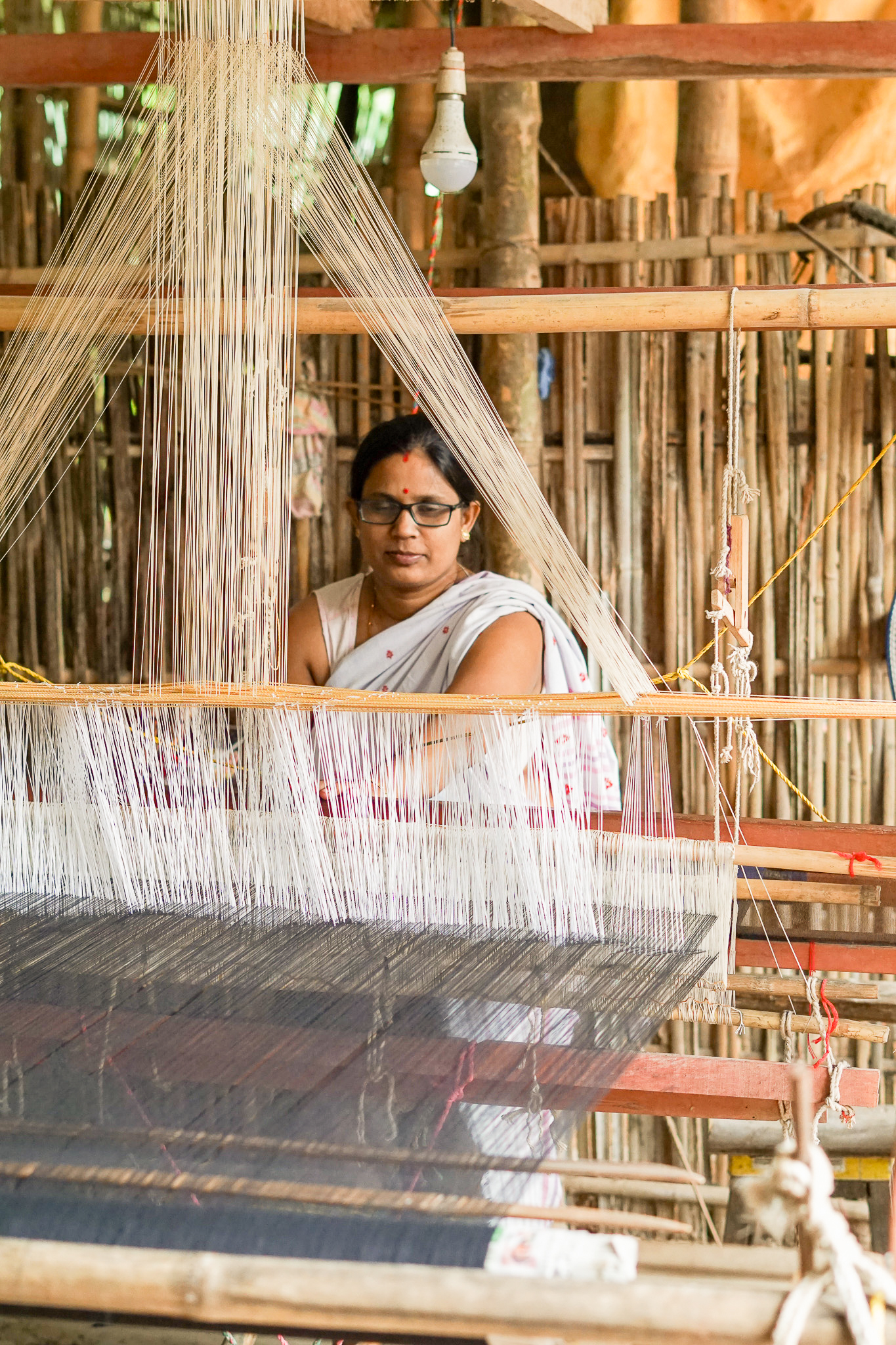 Hands working on a loom